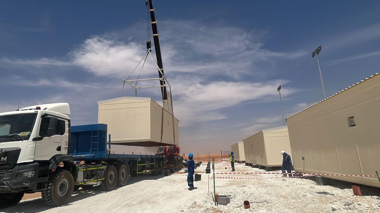 Prefab cabin being craned into place on a UAE site